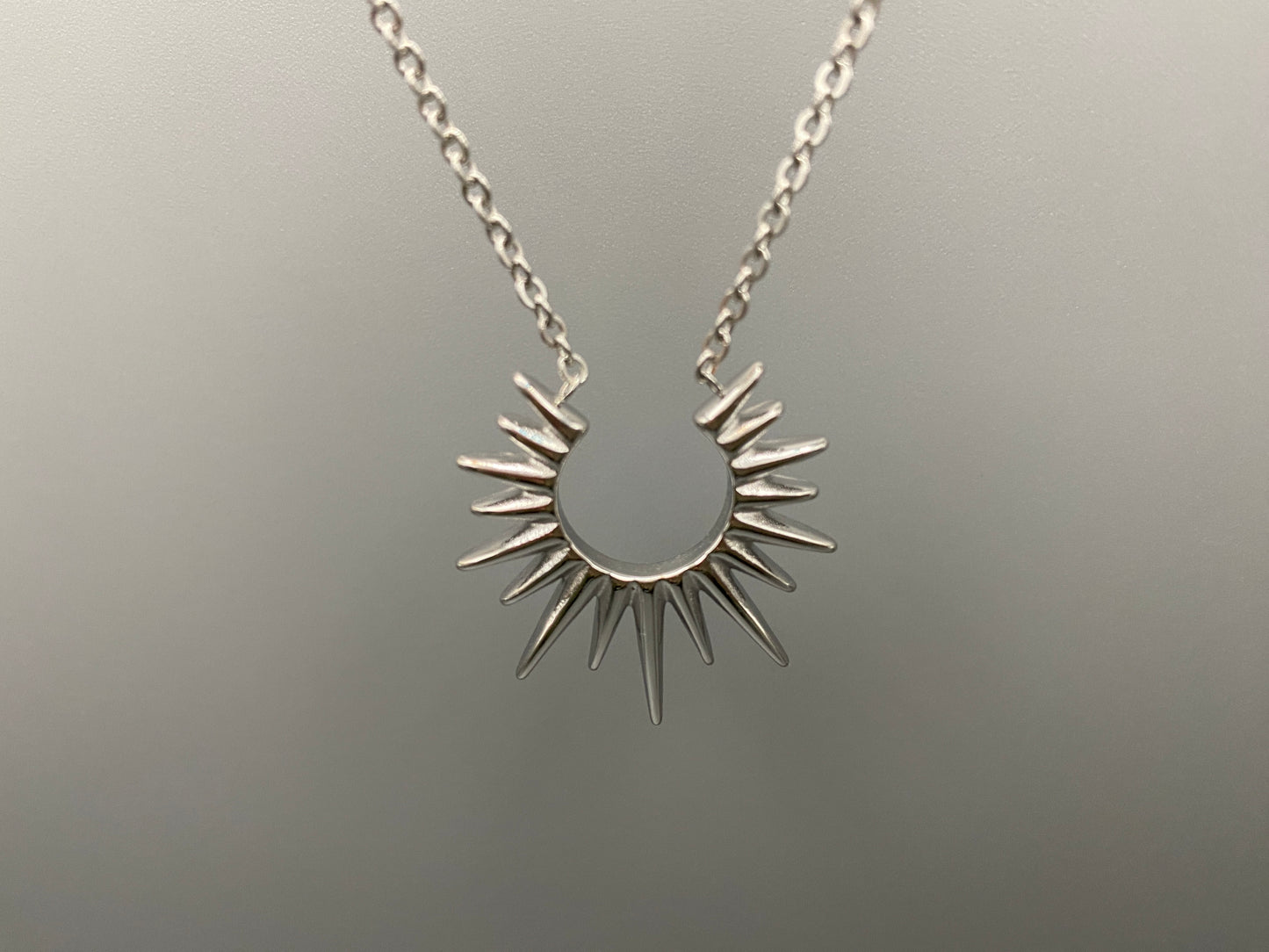Sunburst Pendant Necklace Silver. Radiant and elegant. 18k gold plated pendant. Waterproof, non-tarnish, non-fade. Length: 45 cm + 5 cm extender. Stainless steel construction. Unique sunburst design.