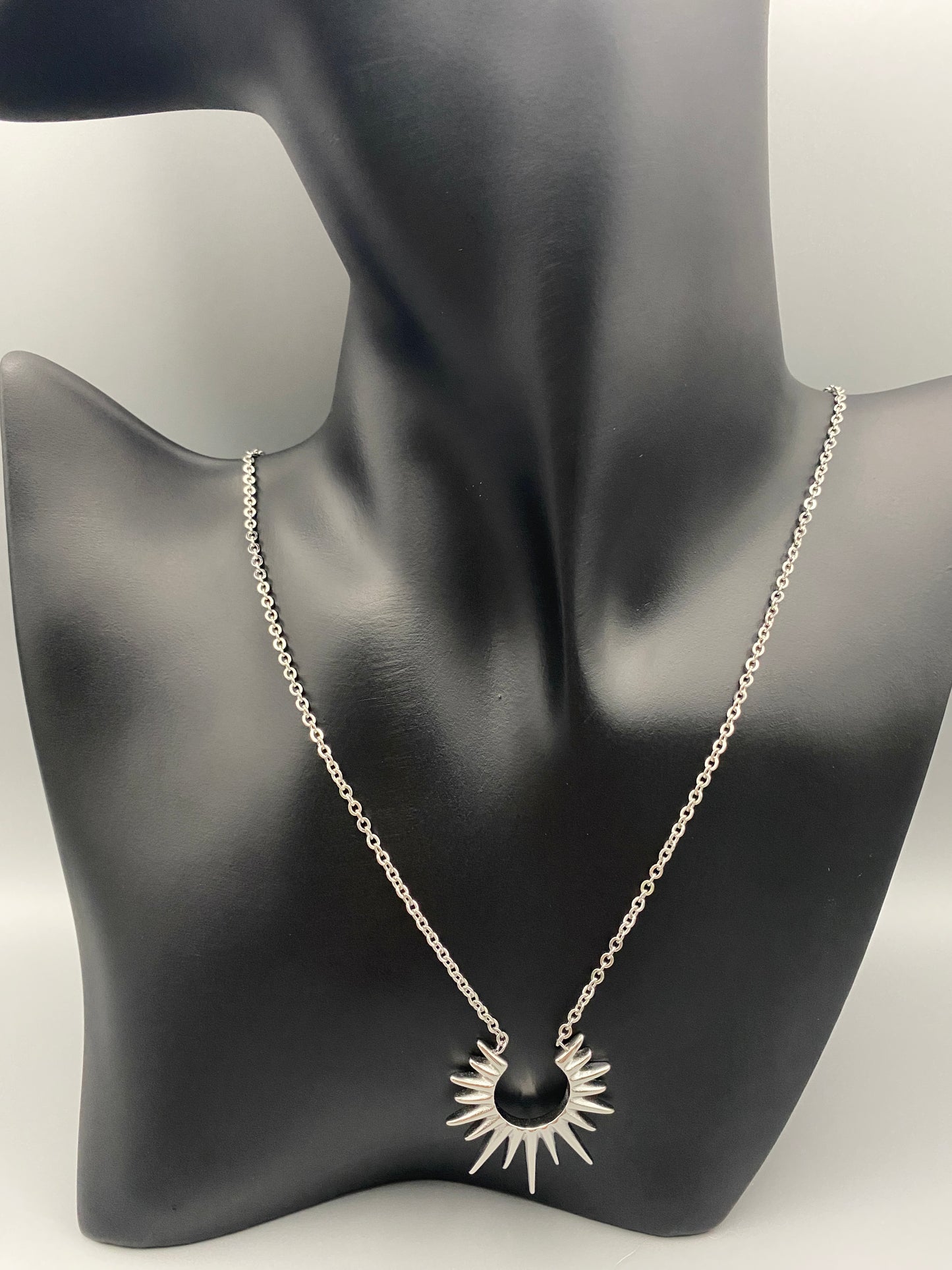 Sunburst Pendant Necklace Silver. Radiant and elegant. 18k gold plated pendant. Waterproof, non-tarnish, non-fade. Length: 45 cm + 5 cm extender. Stainless steel construction. Unique sunburst design.