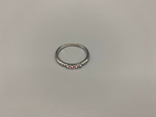 Tanvi Pink Ring: This stunning piece features alternating brilliant blue and clear cubic zirconia stones, set in a sleek silver-plated band. The adjustable fit ensures comfort for any finger size. The ring is non-tarnish and waterproof, maintaining its shine over time. Perfect for everyday wear, the Tanvi ring is your go-to accessory for timeless beauty.