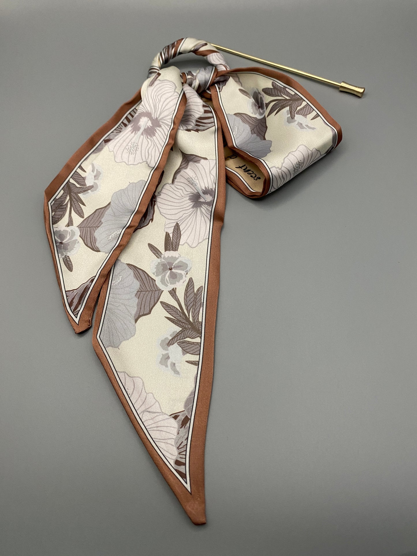 “Tessa Hair Pin Ribbon crafted from luxurious silk with a delicate floral pattern. Designed for both special occasions and everyday wear, it ensures a secure fit and adds a touch of sophistication to any hairstyle.”