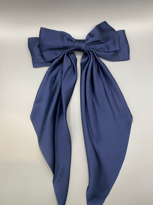 “The Amy Oversized Hair Bow in Navy Blue, crafted from high-quality satin with an oversized bowknot design. Features a minimalist spring clamp for a secure fit. Perfect for stylish updos, daily wear, and special occasions.”