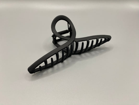 The Bethany Claw Grip Clip in Black, crafted from high-quality metal with a matte black finish. Measures 11 cm, designed for a secure hold and suitable for various hair types and styles. Durable and stylish, perfect for any outfit.”