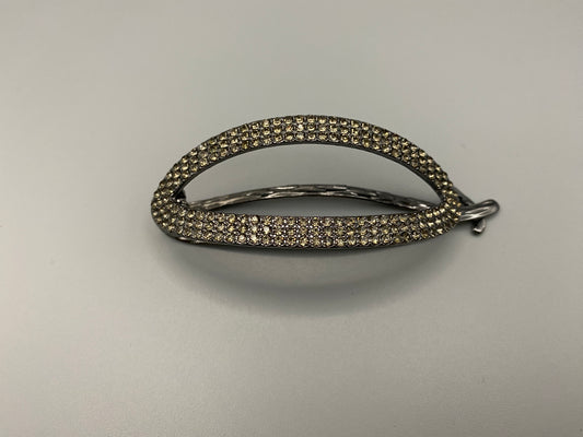 “The Missy Hair Clip, crafted from high-quality metal with sparkling zircon inlaid stones. Features a delicate curved design, measures 9 cm in length, and is perfect for securing various hair types and styles. Durable and luxurious, ideal for effortless beauty.”