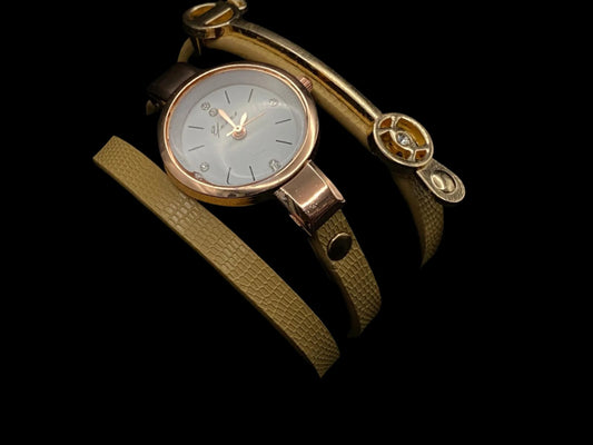 The Natasha Wristwatch Light Brown and Gold.
A luxurious and elegant wristwatch with a black leather strap and a gold face. Features include reliable quartz movement, sparkling crystal accents on the dial, a durable 35mm alloy case, and an adjustable 24cm band with a hook buckle clasp. Note: This watch is not waterproof. Perfect for adding a touch of charm, fashion, and luxury to any outfit.
