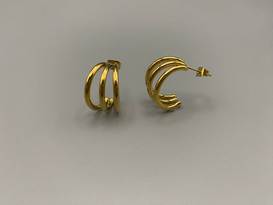 “Trinity 3 Band C Shaped Earrings Gold: A perfect blend of elegance and modern design, featuring a luxurious gold plating, unique three-band C shape, and durable construction. Ideal for both everyday wear and special occasions.”