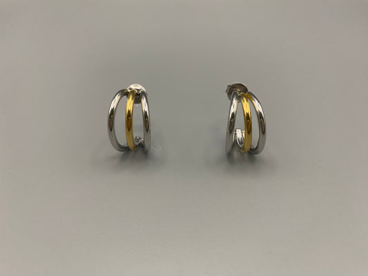 “Trinity 3 Band C Shaped Earrings Gold and Silver: A perfect blend of elegance and modern design, featuring sleek gold and silver bands, a luxurious gold-plated band, and durable stainless steel construction. Unique three-band C shape, ideal for any occasion.”