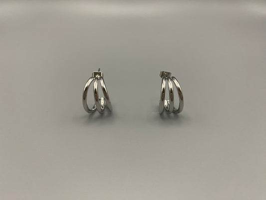 “Trinity 3 Band C Shaped Earrings Silver: A perfect blend of elegance and modern design, featuring sleek silver plating, a unique three-band C shape, and durable stainless steel construction. Ideal for both everyday wear and special occasions.”