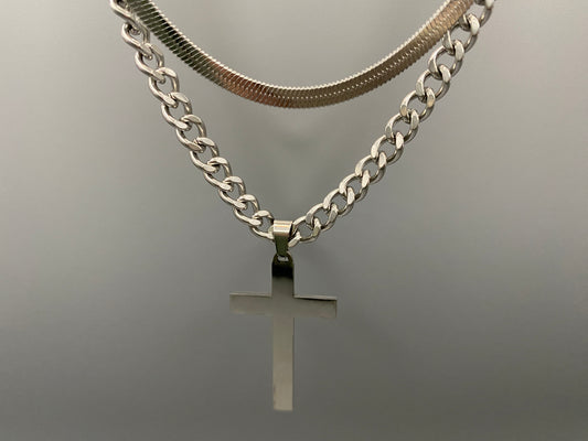 This elegant twin chain cross necklace features a striking black cross pendant, perfect for adding a touch of sophistication to any outfit. The necklace combines a thicker rope chain with a thinner snake chain, offering a unique and stylish look. Crafted from high-quality stainless steel, this piece is designed to last and maintain its shine.&nbsp;

Key Attributes:

Jewelry Main Material:&nbsp;Stainless steel
Shape/Pattern:&nbsp;Cross
Chain Length:&nbsp;Cross chain 25cm, Snake chain length 45 cm + 5 cm exte