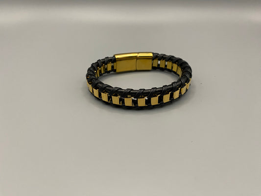 “Urban Edge Wrist Wear Men’s Bracelet in black, crafted from premium stainless steel with a casual and sporty design. Measures 19 cm in length, available in Black Zinc Plated, 18K Gold Plated, and Silver Plated finishes. Features inlay technology for added detail and craftsmanship.”