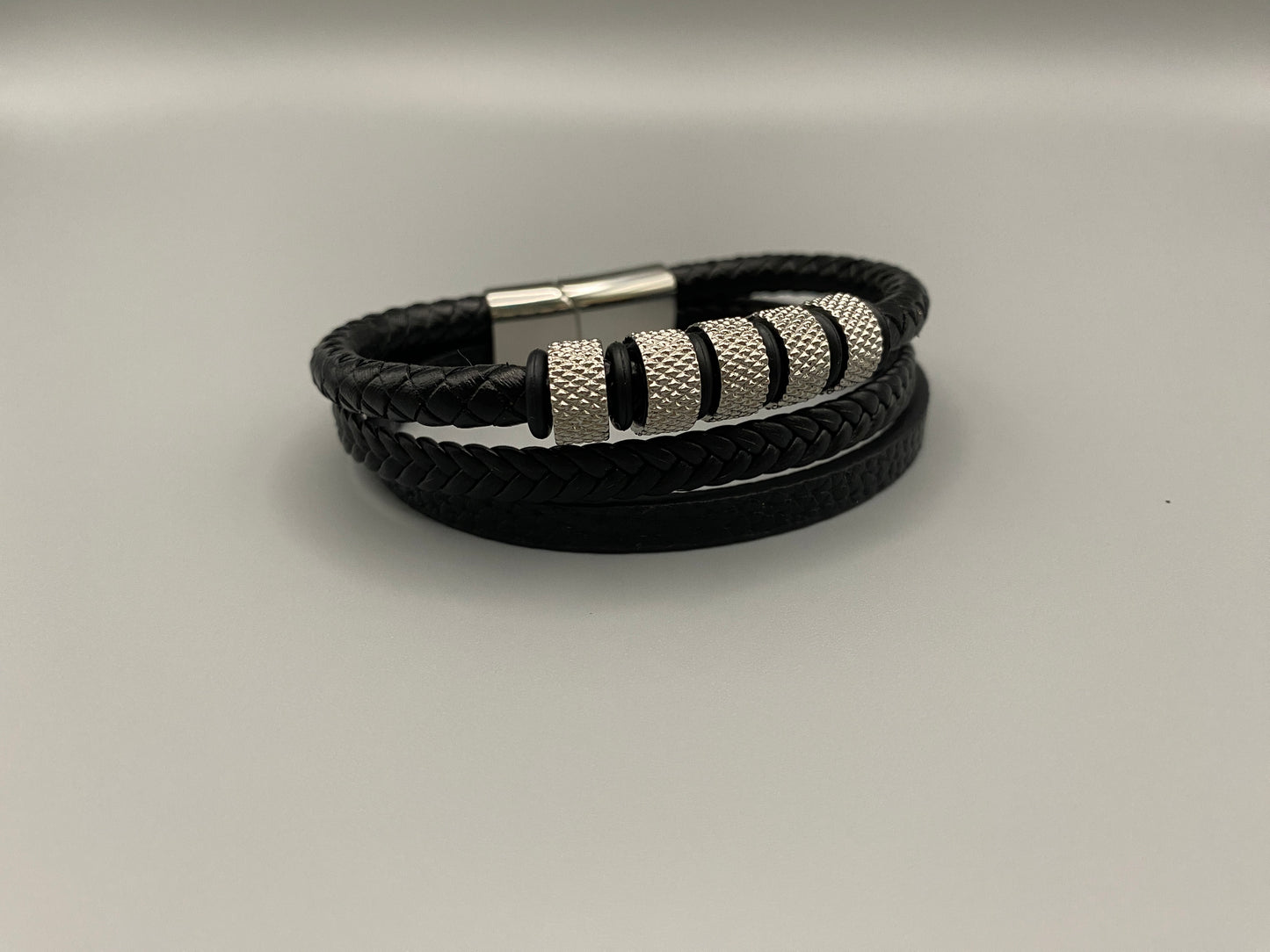 “Urban Pulse Men’s Wrist Wear Bracelet in Black and Silver, featuring a sleek design with alternating black and silver links, perfect for adding a touch of modern elegance to any outfit.”