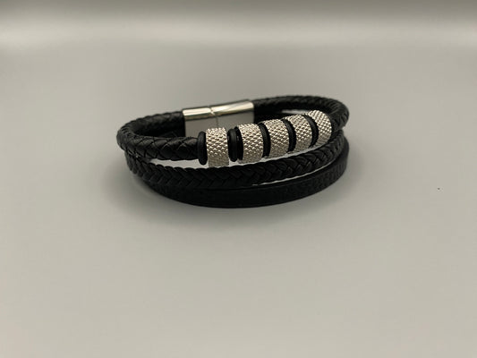 “Urban Pulse Men’s Wrist Wear Bracelet in Black and Silver, featuring a sleek design with alternating black and silver links, perfect for adding a touch of modern elegance to any outfit.”