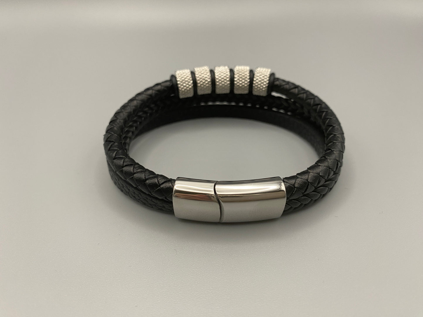 “Urban Pulse Men’s Wrist Wear Bracelet in Black and Silver, featuring a sleek design with alternating black and silver links, perfect for adding a touch of modern elegance to any outfit.”