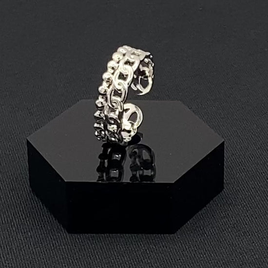 This unique ring features a dual chain design, creating an open and airy look that is both modern and elegant. The open hollow dual chain design adds a contemporary touch, while the plating ensures a luxurious finish. Made from durable titanium and stainless steel, it offers strength and longevity. Available in size 6, it provides a comfortable fit. Perfect for any occasion, this versatile accessory complements both casual and formal outfits.