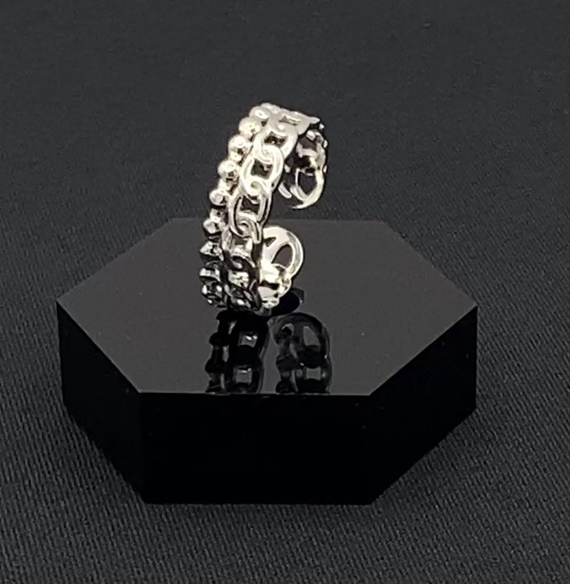 This unique ring features a dual chain design, creating an open and airy look that is both modern and elegant. The open hollow dual chain design adds a contemporary touch, while the plating ensures a luxurious finish. Made from durable titanium and stainless steel, it offers strength and longevity. Available in size 6, it provides a comfortable fit. Perfect for any occasion, this versatile accessory complements both casual and formal outfits.