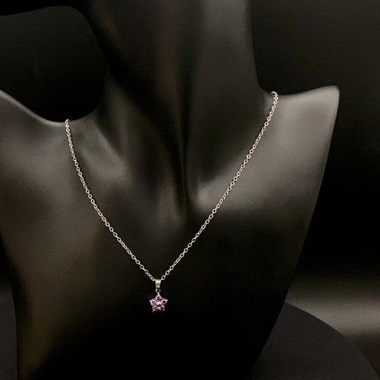 “Blossom Silver Pendant Necklace with a plum blossom design, featuring colourful cubic zirconia stones in a claw setting. Made from durable stainless steel with PVD plating. Measures 46 cm with a 5 cm adjustment.”