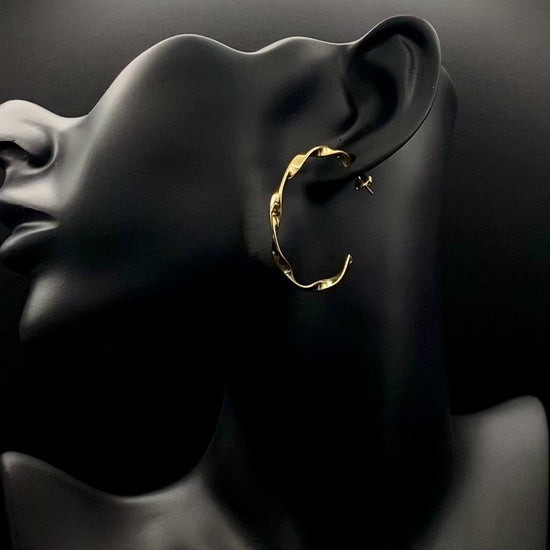 “Leanne C Shape Earrings Gold: Fashion-forward twisted wire earrings with an irregular C-shaped design, crafted from high-quality stainless steel and plated with luxurious 18K gold. Perfect for any occasion.”