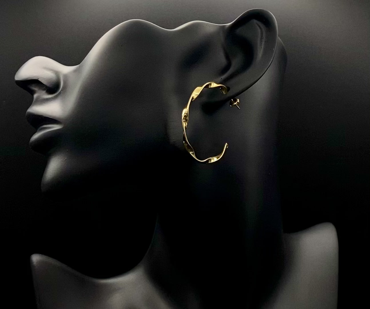 “Leanne C Shape Earrings Gold: Fashion-forward twisted wire earrings with an irregular C-shaped design, crafted from high-quality stainless steel and plated with luxurious 18K gold. Perfect for any occasion.”