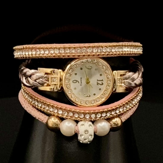 The Melissa Wrist Watch Pink and Gold. Exquisite timepiece with a crystal-studded dial in a sleek alloy case. Luxury quartz movement, genuine leather band, 35mm round case. Adjustable fit with 24cm band length. Non-waterproof. Perfect for charm, fashion, luxury, and antique looks.