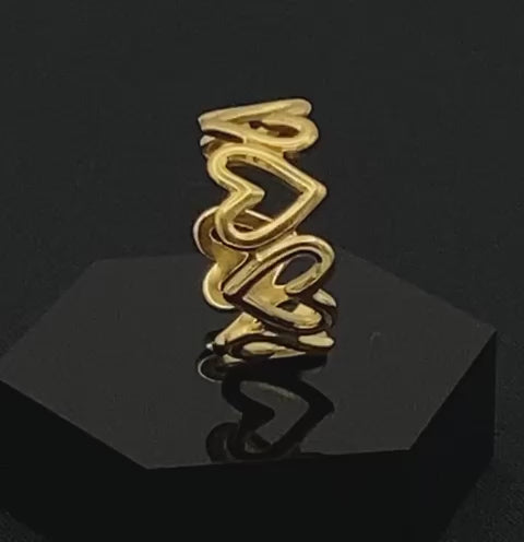 Ring Of Hearts Gold: Embrace elegance and modernity with our Ring of Hearts. Crafted from high-quality stainless steel and plated with 18K gold, this trendy geometric ring features interconnected hearts. Symbolizing unity and love, this adjustable ring is a versatile accessory for any occasion.