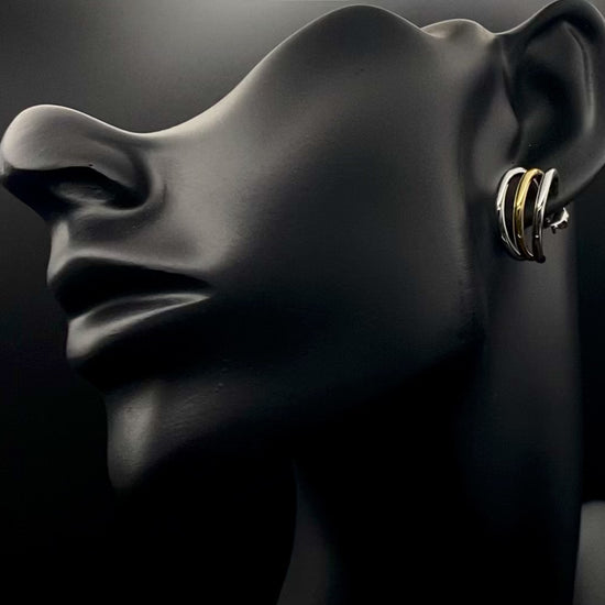 “Trinity 3 Band C Shaped Earrings Gold and Silver: A perfect blend of elegance and modern design, featuring sleek gold and silver bands, a luxurious gold-plated band, and durable stainless steel construction. Unique three-band C shape, ideal for any occasion.”