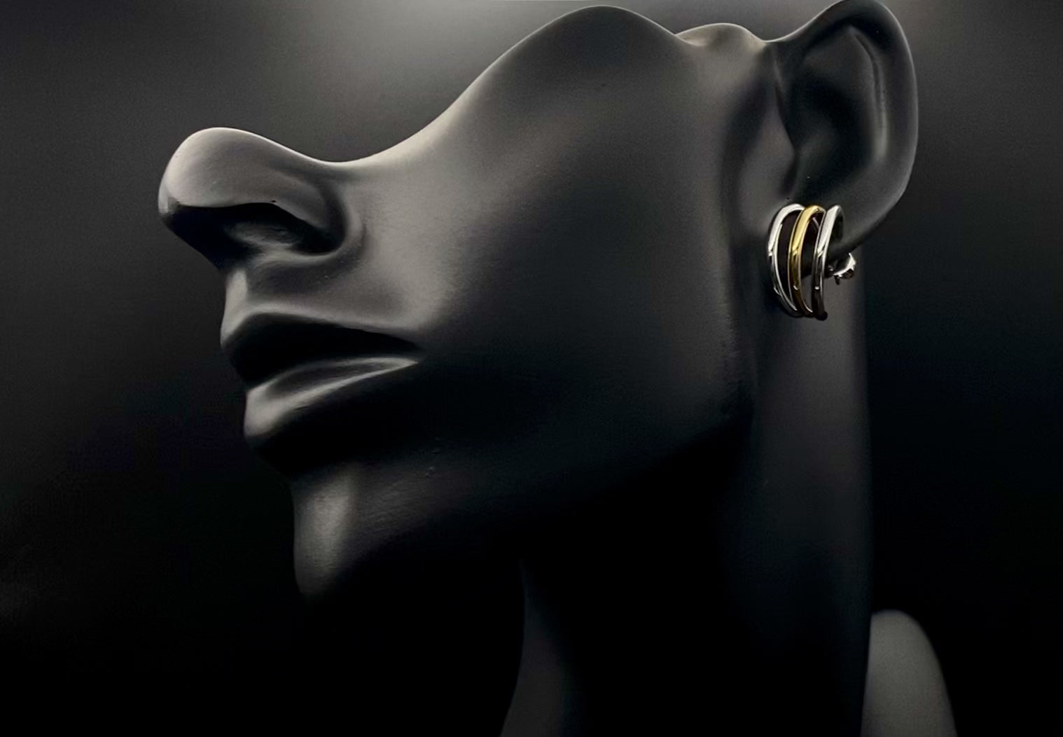 “Trinity 3 Band C Shaped Earrings Gold and Silver: A perfect blend of elegance and modern design, featuring sleek gold and silver bands, a luxurious gold-plated band, and durable stainless steel construction. Unique three-band C shape, ideal for any occasion.”