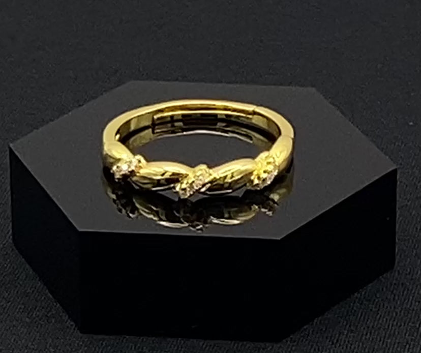 Olivia Adjustable Ring Gold: This exquisite piece is 18k gold plated, offering a luxurious shine and timeless appeal. The ring is waterproof and non-tarnish, ensuring it maintains its beauty over time. Cubic zirconia accents add sparkle and elegance, while the adjustable design ensures a perfect fit for any finger size. Make a statement with this stunning piece that complements any look.