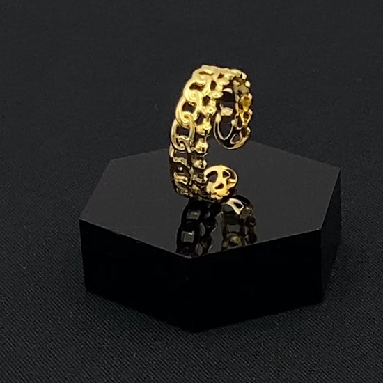 This unique ring features a dual chain design, creating an open and airy look that is both modern and elegant. The open hollow dual chain design adds a contemporary touch, while the gold plating ensures a luxurious finish. Made from durable titanium and stainless steel, it offers strength and longevity. Available in size 6, it provides a comfortable fit. Perfect for any occasion, this versatile accessory complements both casual and formal outfits.