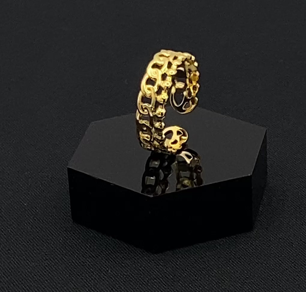 This unique ring features a dual chain design, creating an open and airy look that is both modern and elegant. The open hollow dual chain design adds a contemporary touch, while the gold plating ensures a luxurious finish. Made from durable titanium and stainless steel, it offers strength and longevity. Available in size 6, it provides a comfortable fit. Perfect for any occasion, this versatile accessory complements both casual and formal outfits.