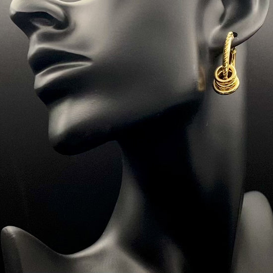 “Vespera Gold Earrings: A perfect blend of elegance and modernity, crafted from hypoallergenic 316L stainless steel and plated with luxurious 18K gold. Durable and high-quality, ideal for sensitive ears and long-lasting shine.”