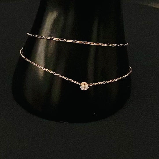 “Aurora Twin Chain Bracelet in rose gold with a sophisticated twin chain design, adorned with zirconia gemstones. Waterproof and measures 18 cm with a 3 cm extender for adjustable fit.”