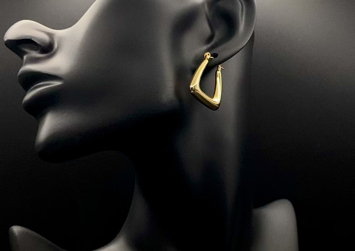 Harmony Gold Earrings made from stainless steel with PVD 18k gold and titanium plating. Hypoallergenic, lead and nickel-free, perfect for sensitive skin. Featuring a trendy geometric shape and tarnish-free colour retention, these earrings blend elegance and durability.