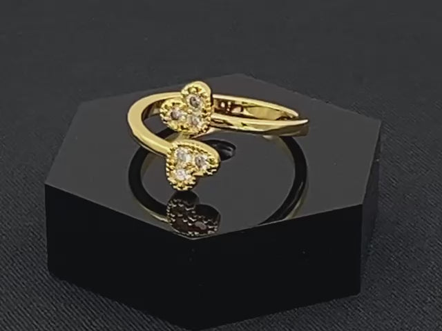Dove Double Heart Adjustable Ring Gold: This beautiful ring features a double heart design, each adorned with sparkling zirconia stones. The elegant design, combined with 18k gold plating, creates a romantic and timeless look. The ring is non-tarnish, waterproof, nickel-free, and non-fading, ensuring it maintains its shine and is safe for sensitive skin. The adjustable size provides a comfortable fit for various finger sizes.