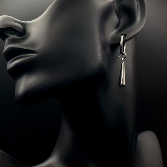 Exquisite Elysian Teardrop Dangle Earrings crafted from high-quality stainless steel and silver plated. Featuring an elegant water drop shape, these earrings offer a timeless vintage style. Ideal for special occasions, they add a touch of sophistication to any outfit. Durable and long-lasting, perfect for elevating your style with classic design and modern craftsmanship.
