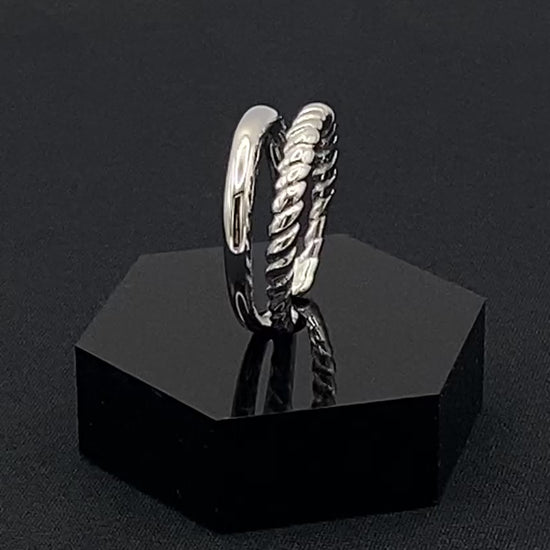 Selene Twin Band Ring Silver: This ring features a unique combination of a textured rope band and a smooth plain band, both gold plated for a luxurious finish. The titanium PVD ensures durability and resistance to wear, while the stainless steel construction adds strength and longevity. The unique twin band design combines elegance and modernity. Available in ring size 7, it is perfect for those who wear this size. Make a statement with this versatile and chic accessory that complements any look.