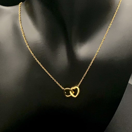 Eternity Twin Hearts Pendant Necklace Gold. Two intertwined hearts symbolizing eternal love. 18k gold, non-tarnish, waterproof, non-fade. Adjustable length: 41 cm + 5 cm extender. Elegant and versatile for any occasion.