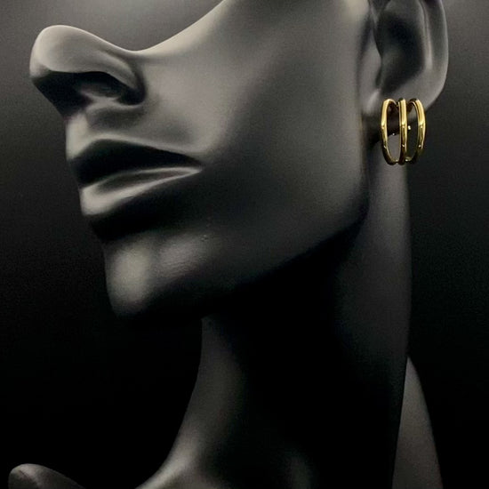 “Trinity 3 Band C Shaped Earrings Gold: A perfect blend of elegance and modern design, featuring a luxurious gold plating, unique three-band C shape, and durable construction. Ideal for both everyday wear and special occasions.”