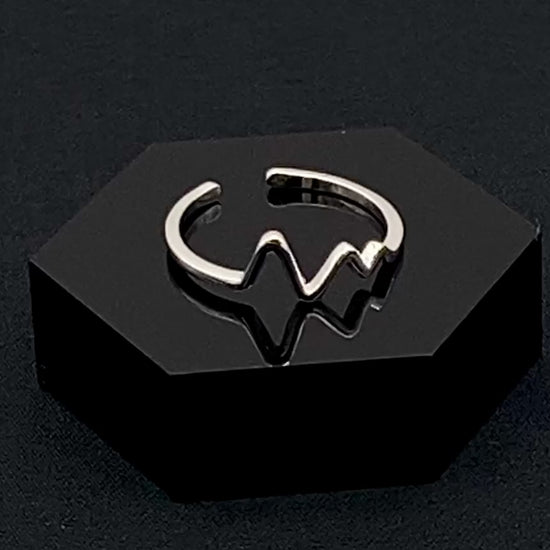 Pulse Ring Silver: This adjustable ring features a heartbeat pattern, crafted from high-quality 925 sterling silver and plated with a non-tarnish, waterproof finish. It is designed to be anti-allergy, making it perfect for any occasion, whether it’s an anniversary, engagement, wedding, or party.