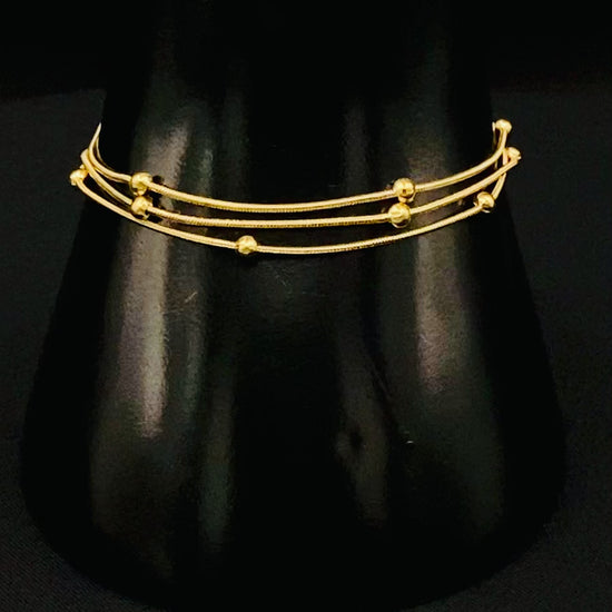 Freya Tri-Chained Bead Bracelet in gold with three delicate chains and evenly spaced small beads. 18K gold plated, made from durable stainless steel with PVD plating. Measures 18 cm with a 3 cm extender for adjustable fit.”