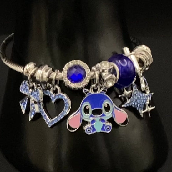 “Cartoon Character Bracelet in Blue with a playful and stylish design, made from durable stainless steel, alloy charms, crystals, and glass beads. Adjustable 6cm diameter for a comfortable fit.”