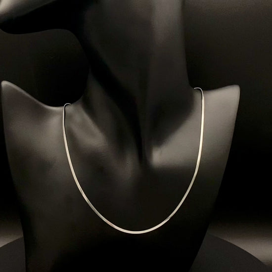 Dahlia Flat Snake Chain Silver Necklace. Sleek and sophisticated accessory. High-quality stainless steel, anti-tarnish, waterproof. Flat snake chain, 2mm width. Adjustable length: 40cm + 5cm extender. Modern and trendy design, perfect for layering or solo wear.