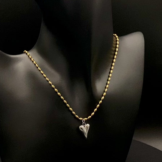 Solara Silver Heart Gold Pendant Necklace. Elegant and charming. 18k gold plated chain with a stainless steel heart pendant. Durable, sophisticated look. Adjustable length: 41 cm + 5 cm extension. Perfect for everyday wear and special occasions.