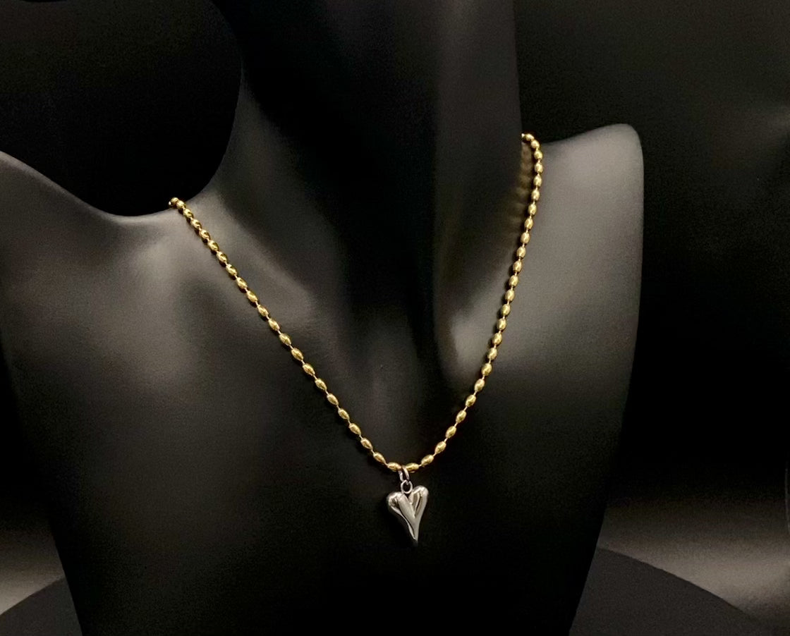 Solara Silver Heart Gold Pendant Necklace. Elegant and charming. 18k gold plated chain with a stainless steel heart pendant. Durable, sophisticated look. Adjustable length: 41 cm + 5 cm extension. Perfect for everyday wear and special occasions.