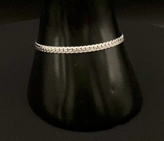 “Seraphina Bracelet in Silver with a unique snake-linked design, featuring luxurious Silver plating. Adjustable length of 17 cm with a 3 cm extension. Durable construction ensures long-lasting wear and tarnish resistance.”