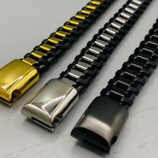 “Urban Edge Wrist Wear Men’s Bracelet in black, crafted from premium stainless steel with a casual and sporty design. Measures 19 cm in length, available in Black Zinc Plated, 18K Gold Plated, and Silver Plated finishes. Features inlay technology for added detail and craftsmanship.”