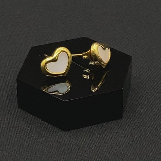Versatile and elegant Helena Heart Earrings featuring a white shell heart pendant, crafted from high-quality titanium steel and plated with 18k gold. These earrings are waterproof, tarnish-free, and environmentally friendly, offering a trendy style and superior craftsmanship.