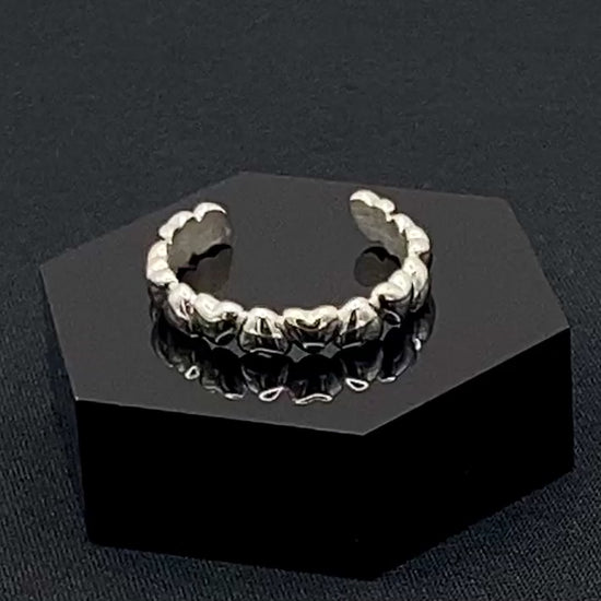 Bianca Stainless Steel Ring: Crafted from high-quality 316L stainless steel, this ring features a sleek, intertwined design that exudes sophistication. Available in size 7, it combines durability with a trendy, elegant pattern.