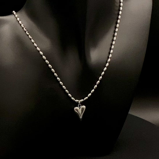 Solara Silver Heart Silver Pendant Necklace. Elegant and charming. Silver chain with a stainless steel heart pendant. Durable, polished finish. Adjustable length: 41 cm + 5 cm extension. Perfect for everyday wear and special occasions.