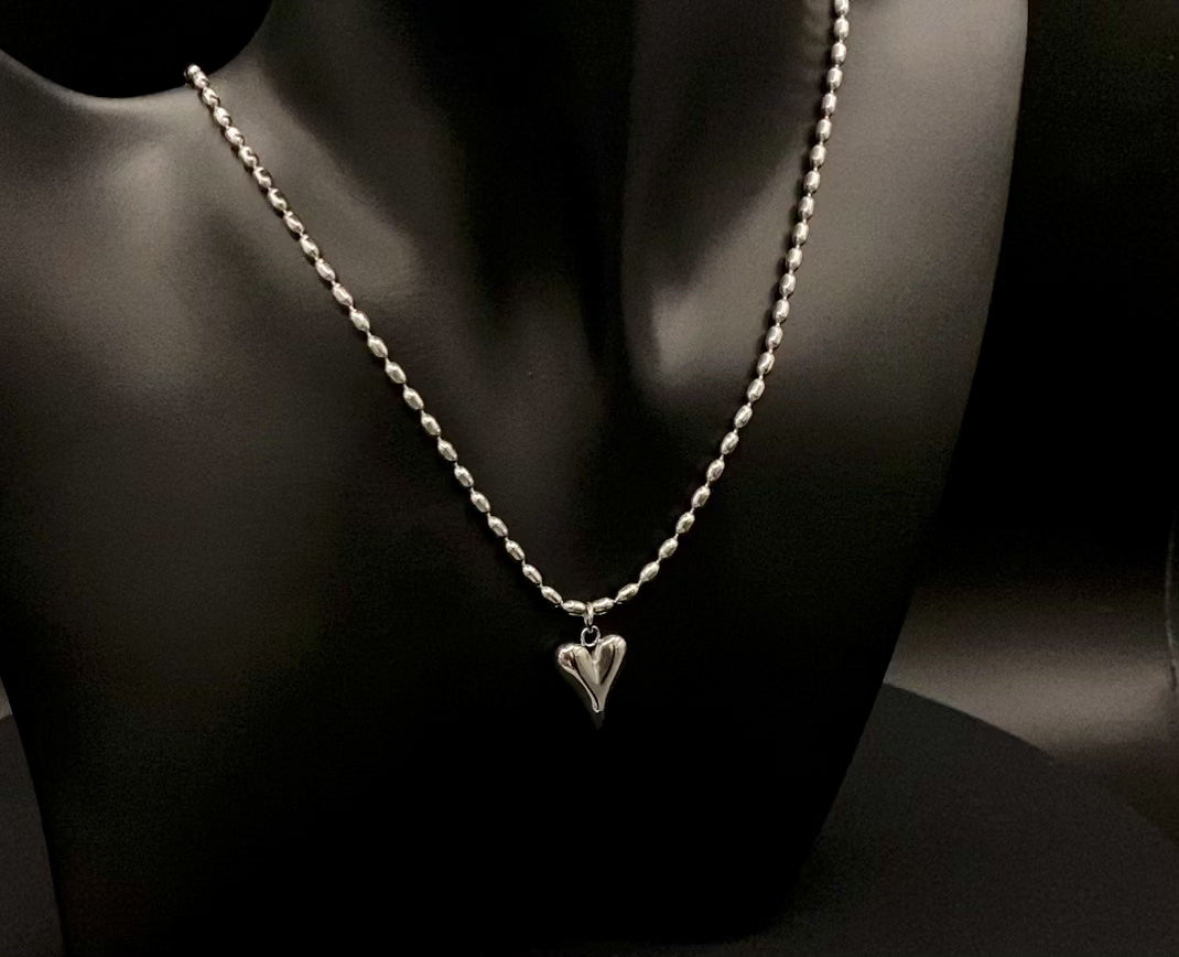 Solara Silver Heart Silver Pendant Necklace. Elegant and charming. Silver chain with a stainless steel heart pendant. Durable, polished finish. Adjustable length: 41 cm + 5 cm extension. Perfect for everyday wear and special occasions.