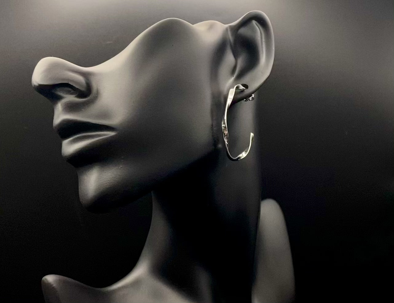 “Leanne C Shape Earrings Silver: Fashion-forward twisted wire earrings with an irregular C-shaped design, crafted from high-quality stainless steel and plated with luxurious silver. Perfect for any occasion.”