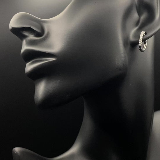 “Taga Elegant Hoop Earrings Silver: A perfect blend of sophistication and modern design, featuring silver plating for a luxurious finish, durable stainless steel construction, and sparkling zirconia gems. Stylish and contemporary, perfect for any occasion.”